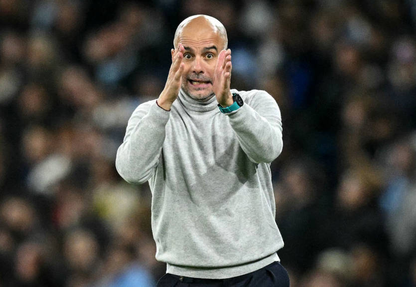 Сдерживали двое: Гвардиола пытался наброситься на фаната после провокации